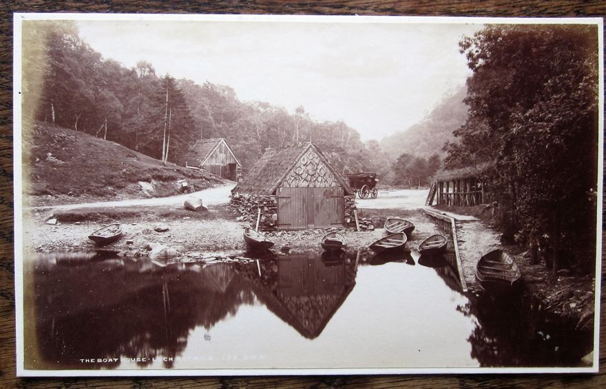 A photograph c1880 of the old boathouse at Loch Katrine. George Washington Wilson was the photographer.